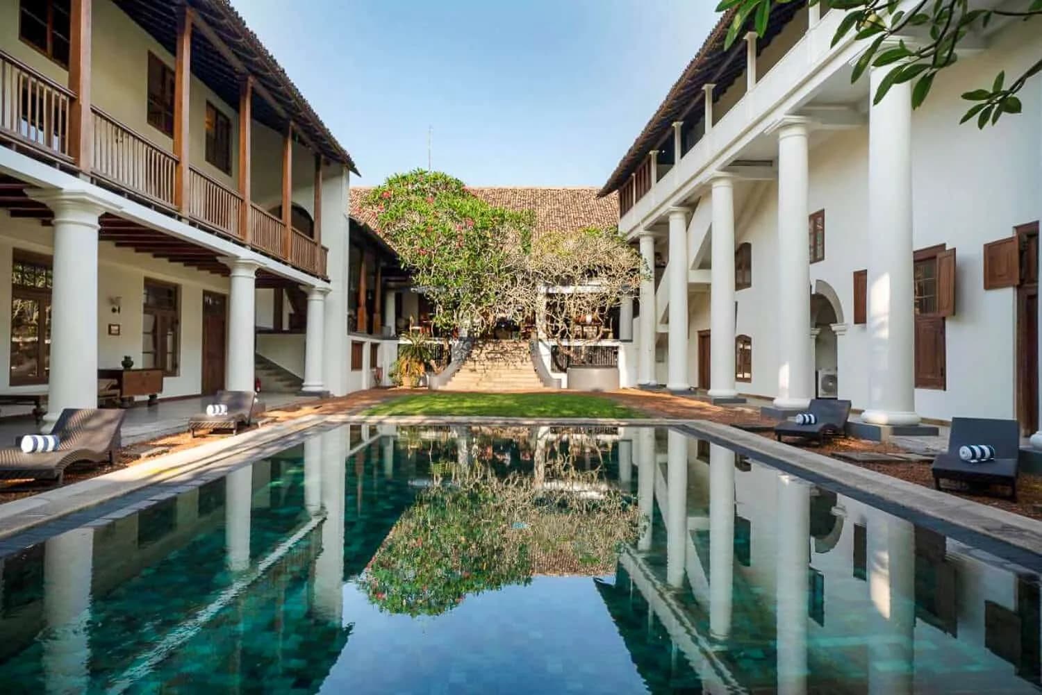 Colonial-style hotel courtyard with a pool in Sri Lanka